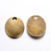 Bronsfärgade berlocker - oval tag 10x8 mm