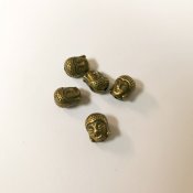 Bronsfärgade pärlor mellandelar buddha